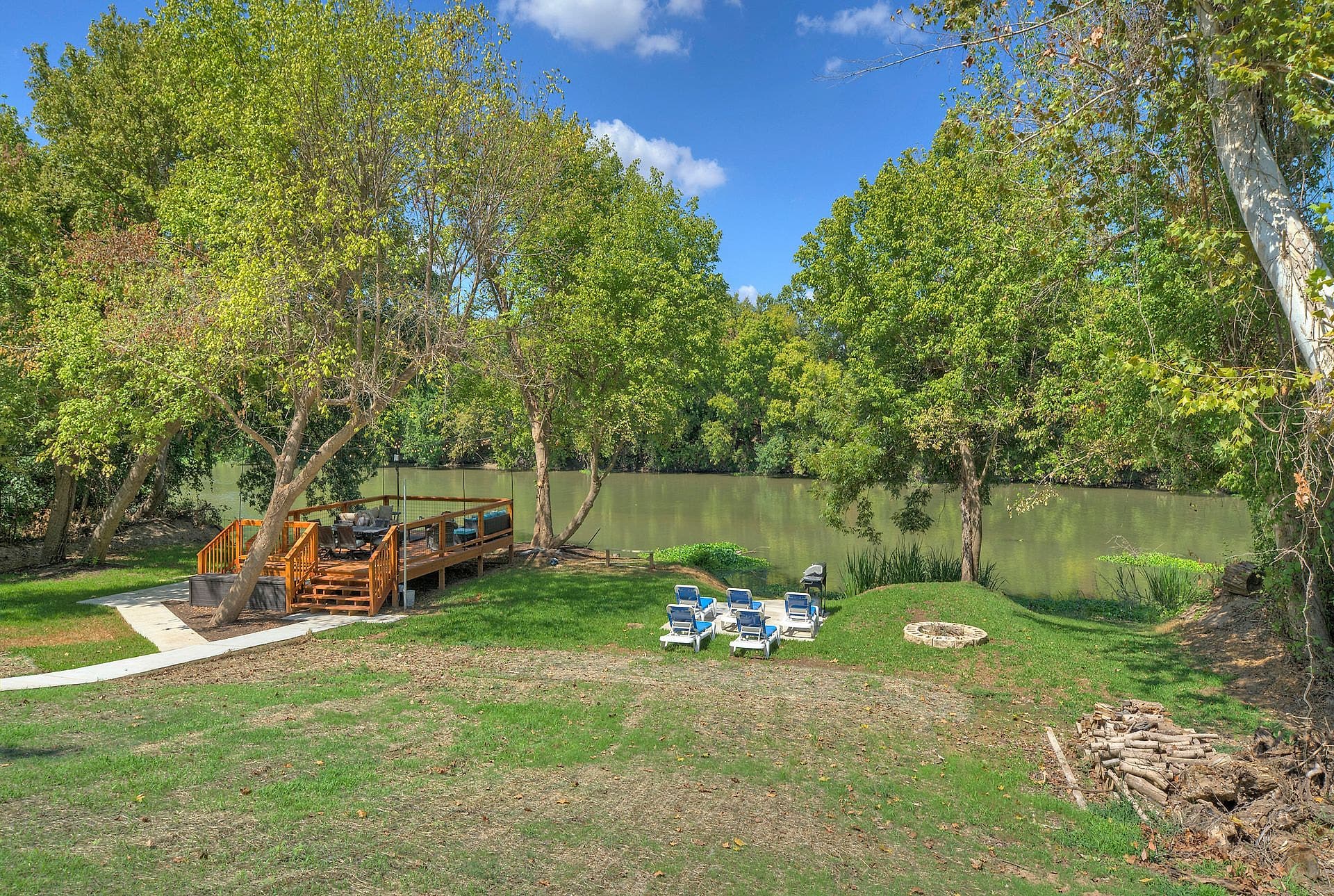 Stone fire pit, loungers and the river viewing deck on the Colorado River