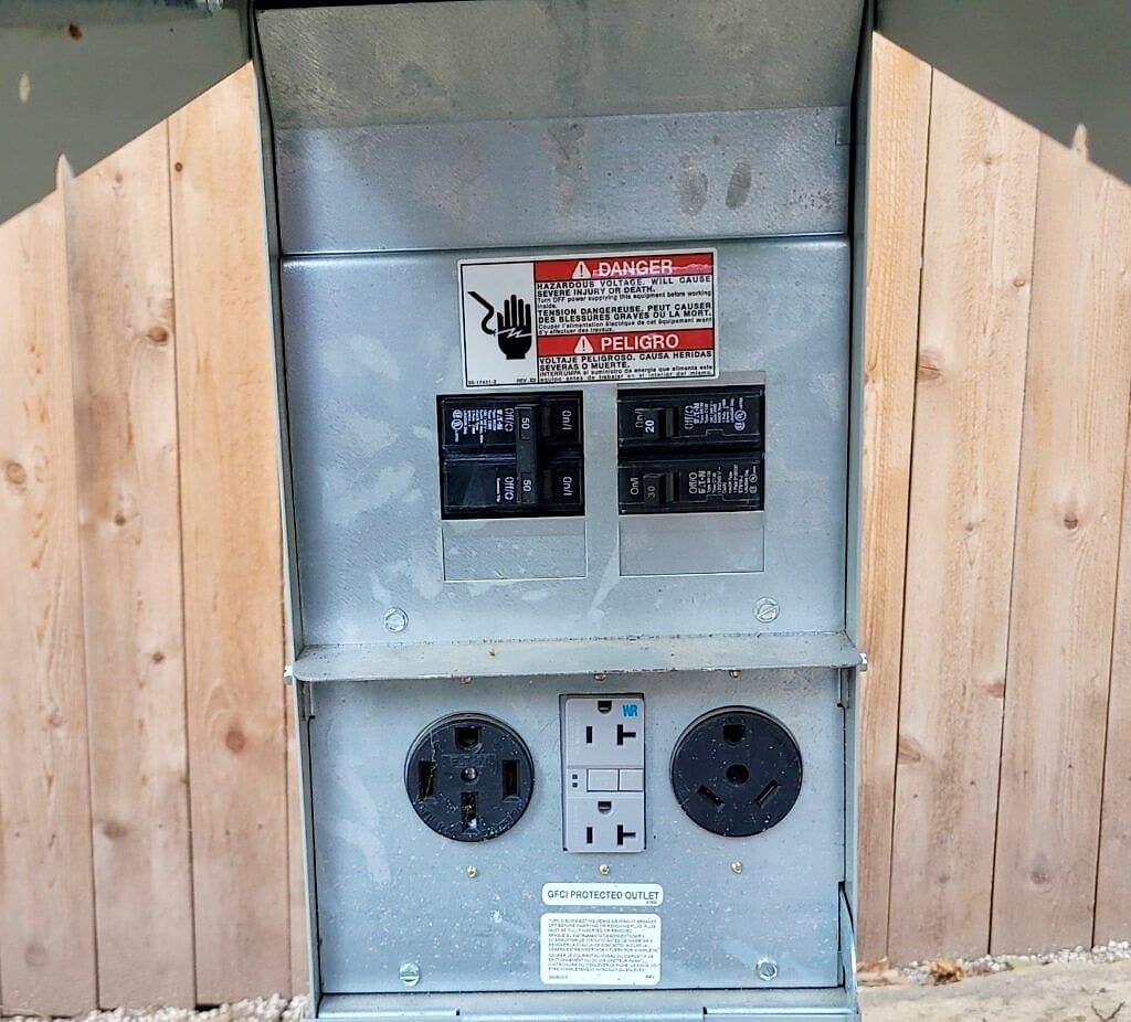 RV hookup pedestal with 30-amp, 50-amp and 110-volt outlets